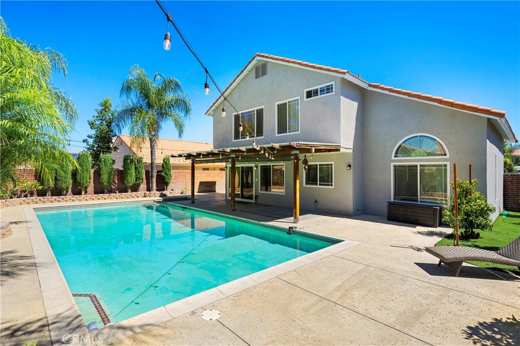 Welcome to this stunning pool home located in the desirable Southwest Hemet community!
Step inside to soaring cathedral ceilings in the formal living and dining rooms, complimented by expansive windows for natural light. The family room offers a cozy fireplace and large sliding doors that open to your private backyard retreat. Travertine flooring with upgraded base moldings throughout downstairs, along with a large laundry room, a generous walk-in pantry, and a convenient powder room on the first level are some of the bonus features.
Upstairs, the expansive primary suite offers a large walk-in closet and the en-suite bathroom features dual vanities, a soaking tub, and a separate shower. Down the hallway, you’ll find three additional bedrooms and a full bathroom, all enhanced by elegant laminate plank flooring throughout the upper level.
The backyard is an entertainer’s dream with resort-style in-ground pool and spa, spacious patio area, block wall fencing for privacy, and lush landscaping with fruit trees.
Additional highlights include newer dual-pane windows with upgraded blinds throughout, lots of storage cabinets in the garage, whole house fan, front porch and an extended driveway offering ample parking.
Enjoy NO HOA, low taxes, and no Mello-Roos. Ideally located within walking distance to elementary and high schools, parks, and very good proximity to shopping and dining. Easy access to the 215, 15, 10, and 60 freeways for convenient commute.