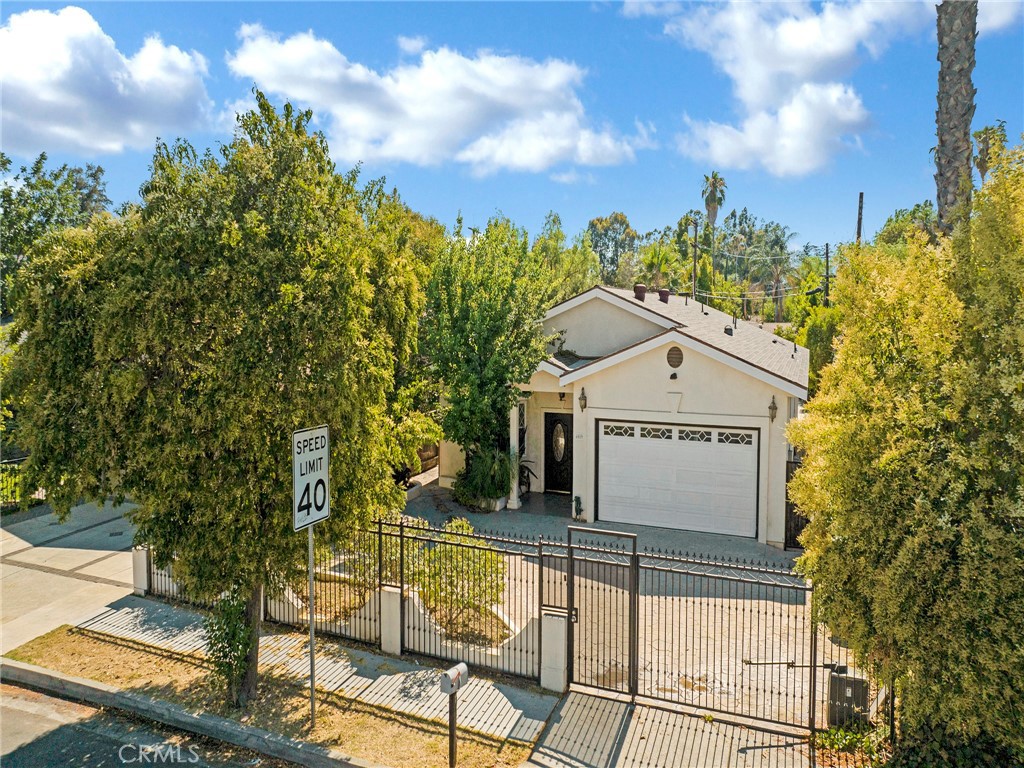 Welcome to this beautifully updated 4-bedroom, 4-bathroom home located in sought-after community of Tarzana. This charming residence offers over 2,600 sqft of living space on a spacious 8407 lot. Featuring an open-concept layout, this spacious residence is perfect for both everyday living and stylish entertaining. Front entry door will lead you into an open floor spacious living and dining area and fireplace.
The fully remodeled open space kitchen is a standout with beautiful countertops, custom cabinetry, stainless steel appliances, beautiful tile floors, and an oversized island. The master bedroom has plenty of space with wood floors, walk-in closet, and renovated ensuite bathroom featuring spacious walk-in shower, and updated fixtures throughout. The other 3 spacious bedrooms feature wood floors and plenty of closet. The bathrooms has been tastefully renovated with high-end finishes, including tile, vanities, and showers—creating a spa-like experience throughout. Additional highlights include recess lighting, central HVAC, and plenty of light.
Step outside to your private backyard oasis featuring plenty of fruit trees and space ideal for outdoor gatherings, RTI ready for adding an ADU. This beautiful home is located near many restaurants, shops, places of worship, and grocery stores. This property is also for lease. Don’t miss the opportunity to make this turn-key home your own!