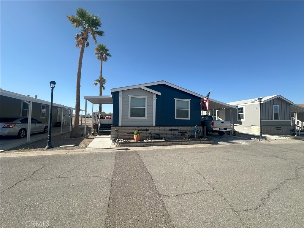 This newer 3-bedroom, 2-bathroom home is in Santiago Coronado Village near the Colorado River! It has a large main suite with a full private bathroom and offers an open floor plan that opens up to the kitchen and dining area, with a laundry room off the kitchen. A covered carport with plenty of space to park a boat and a golf cart. Covered porch. This gated community offers a clubhouse with all the amenities: a full kitchen and living room, a game room, a swimming pool, and a playground. Spectacular Mountain and desert sunset views. There's no time like the present to own a home... Call today to schedule a showing!