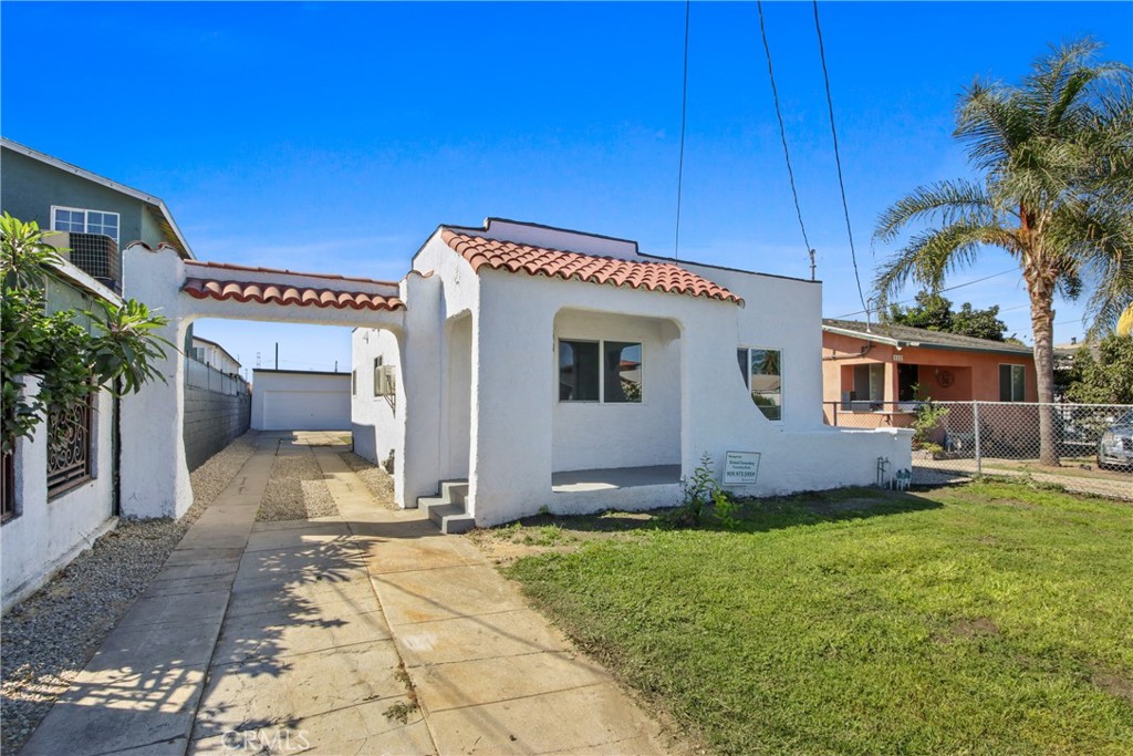 SPANISH CHARMER with long drive way and two car garage detached with extra bonus room. Sharp and newly remodeled 3bd/2ba single family residence located on a terrific tree-lined street close to Downtown LA. Terrific curb appeal, gated entrance, light/bright living room, beautiful kitchen w/ custom cabinetry and quartz counters. Inside laundry room. Master bedroom w/ en-suite spacious bathroom. All three bedrooms offer ample living/closet space. Both bathrooms have been beautifully remodeled with custom cabinetry, quartz counters and custom tile and hardware. Beautiful hard wood-like flooring thru out the home with custom hardware/lighting. NEW Mini Split air conditioning system Privately enclosed Large Back Yard with patio and large grassy areas. Very private LARGE BONUS ROOM connected to the two car detached garage. No need to preview . . . Located in the heart of the city with convenient access to the 110 Freeway, parks, schools, shopping, and all that Los Angeles has to offer, Immaculate!