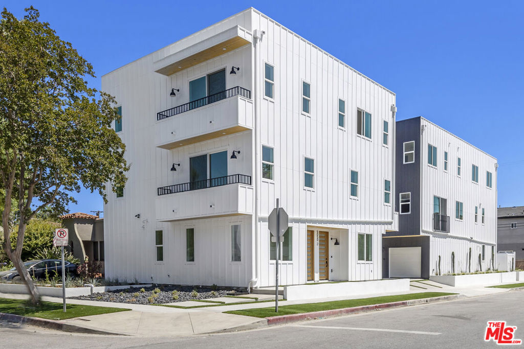 Experience modern urban living in this stylish North Hollywood townhouse featuring 3 bedrooms and 3.5 baths. The ground floor offers a private en-suite bedroom and a versatile flex space perfect for an office, playroom, or oversized mudroom. Upstairs, the open-concept main level boasts a chef's kitchen with stainless steel appliances, custom cabinetry, and a large eat-in island flowing seamlessly into the living and dining areas, plus a convenient powder bath for you and your guests. The top floor includes two spacious en-suite bedrooms with spa-inspired bathrooms, walk-in closets, and blackout roller shades. Additional highlights include in-unit laundry, central A/C and heat, and two designated parking spaces. Located just minutes from NoHo's vibrant arts district, dining, and entertainment, this home blends style, comfort, and convenience in one of LA's most dynamic neighborhoods. Some photos may be of a similar unit.