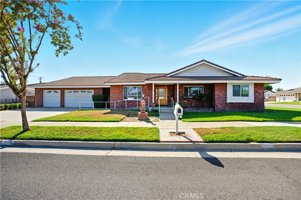 Welcome to this spacious single-story corner lot home offering the perfect blend of comfort, functionality, and convenience. Featuring 3 bedrooms and 4 bathrooms, this thoughtfully designed residence is ideal for both everyday living and entertaining. Step inside to a bright and open floor plan where the living room flows seamlessly into the dining area, creating an inviting space for family gatherings and special occasions. Just beyond, a large family room with a cozy fireplace and sliding glass doors provides easy access to the backyard. The open kitchen overlooks the family room, ensuring you’re always connected while cooking or hosting. The large primary bedroom offers mirrored closet doors, a private ¾ bathroom, and direct access to the backyard for a relaxing retreat. Two additional bedrooms are equally spacious, with nearby full and ¾ bathrooms conveniently located off the hallway. A dedicated laundry room with its own ¾ bathroom adds practicality and direct entry to the impressive 6-car attached garage. Step outside to enjoy a backyard with a covered patio. Features include recessed lighting, dual-pane windows, and central AC & heat for year-round comfort. Nearby schools, parks, and shopping centers make this location as convenient as it is desirable. Don’t miss the opportunity to make this beautiful home your own.
