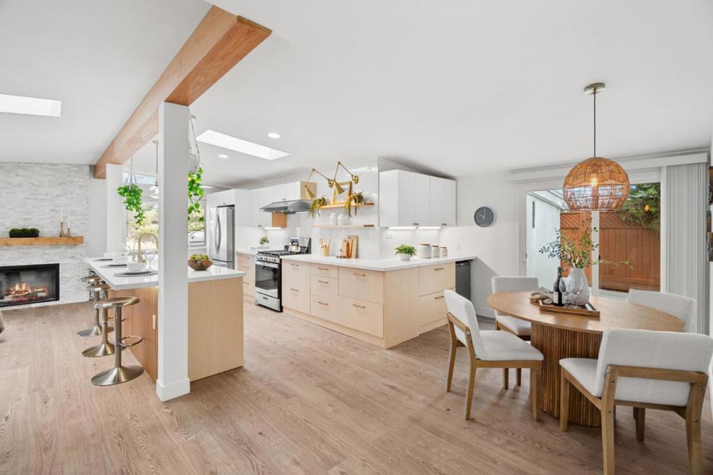 Comprehensively remodeled from top to bottom under the direction of a renowned interior designer, this single family home + detached office unit was meticulously designed and improved with the intention of being the owners' forever home and, as a result, there are simply too many upgrades to list, both inside and out. Step inside and youll immediately be struck by the openness of the light-filled layout and the luxuriousness of its centerpiece, the wrap-around chefs kitchen with premium modern cabinetry and quartz countertops with full backsplash. Not a single square foot of space is wasted in the spacious great room or in three comfortably sized bedrooms (including a master with mini-split air conditioning and slider access to the back patio and yard) and two fully remodeled bathrooms with designer-selected vanities and finishes and striking floor-to-ceiling tiled shower walls for low-maintenance luxury. Despite its central Santa Clara location, just a short walk from a legendary donut at Stans and the International Swim Center, the backyard is uncommonly idyllic, thanks to the neighbor to the rear -- the Santa Clara Library. The owner worked from home the past year from the quiet detached office, which can also easily work as a man cave/she shed or small workout/yoga space.