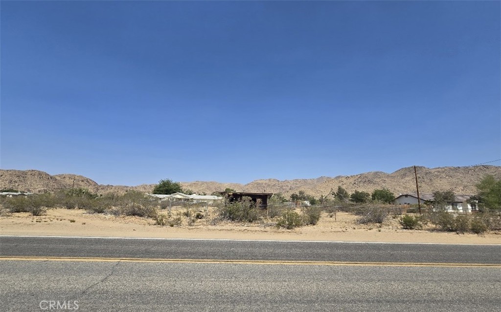 Welcome to 14963 Laguna Seca Drive, a rare 1-acre corner lot in the scenic High Desert community of Apple Valley, California. Perfectly situated on a paved road, this property combines easy access with stunning mountain and desert views, making it an ideal spot to build your custom desert home retreat. The lot comes with a water meter already installed (serviced by Thunderbird Water) and electricity available on both the North and South sides, with neighboring Southern California Edison power poles for easy connection. A portion of the property is chain-link fenced, adding security and cutting down on your upfront fencing costs. Adding unique character, the property includes a nostalgic 1950s-era cabin shell and a small shed/animal shelter. These vintage structures reflect the property’s history and maybe could be retained and/or restored as part of your future build, offering opportunities for creative repurposing or inspiration. Enjoy breathtaking panoramic views of the surrounding mountains and desert landscapes, embracing the peace and quiet that the High Desert lifestyle offers. Whether you’re planning a full-time residence, a weekend getaway, or a smart investment in a growing community, this lot combines utilities, location, charm, and potential in one exceptional package. Don’t miss your chance to own a slice of Apple Valley paradise—where open space meets opportunity and your vision can become reality. APN: 0436-244-52-0000