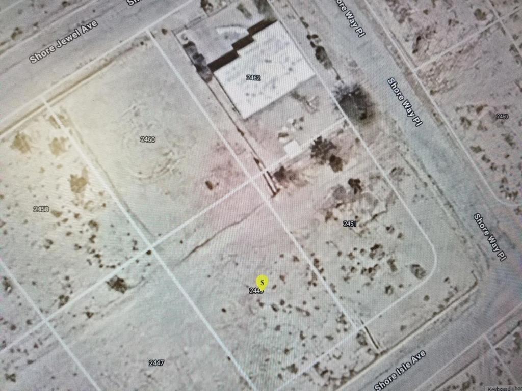 2449 Shore Isle Av, Salton City. Area of Salton Sea. Nice size Vacant Residential lot. 9,978 sf. Adjacent to existing home. Utilities at street front and/or rear of property. Telephone pole at rear property line. You own the land in fee. Centrally located in Salton City close to middle and high schools, shopping, stores, library, senior center, gas station, clinic and Red Earth Casino. No HOA, Lower IID electric. APN 012-151-012Seller and/or agent make no warranties. All information deed reliable but buyer to do their own due diligence to satisfy themselves.