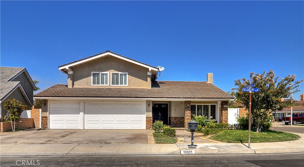 Welcome to this private corner-lot home in the sought-after Bolsa Landmark community. Featuring a convenient downstairs bedroom and bath, the home is filled with soaring ceilings, warm hardwood floors, and abundant natural light. The remodeled kitchen offers granite countertops, custom cabinetry, and a breakfast bar overlooking a sun-drenched backyard retreat with mature palms, patios, and a fire pit, perfect for morning coffee or evening gatherings. The spacious primary suite is a true escape with a soaking tub, walk-in shower, dual vanity, and walk-in closet. Enjoy refreshing ocean breezes, ample garage storage, and direct access to the Bolsa Chica Wetlands. Central Park is nearby with walking trails, playgrounds, a dog park, and an equestrian center, along with beach proximity ideal for an active coastal lifestyle. Located within the Seacliff Elementary School District, this home combines privacy, convenience, and location in one of Huntington Beach’s most desirable neighborhoods.