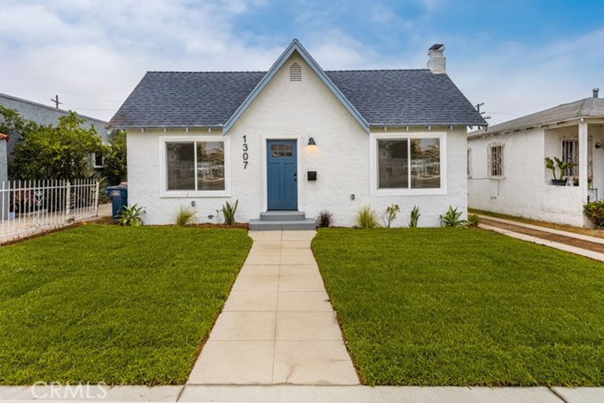 Welcome to 1307 W 104th St, a beautifully reimagined home that blends modern comfort with timeless charm. From the moment you arrive, the inviting curb appeal sets the tone—clean lines, fresh landscaping, and a welcoming exterior create a picture-perfect first impression. Inside, an open and airy floor plan greets you with copious amounts of natural light pouring in through well-placed windows, creating a bright, uplifting atmosphere throughout.

With nearly 1,800 square feet of living space, this home offers five generously sized bedrooms and three full bathrooms—ideal for large households, multigenerational living, or anyone who craves extra space. Each bedroom offers comfort and privacy, while all three bathrooms have been upgraded with stylish fixtures and modern finishes that elevate the everyday.

The heart of the home is the chef’s kitchen, designed to impress and perform. Open shelving, a custom backsplash, and a sleek island make this space both functional and visually striking. The layout flows seamlessly into a separate dining area, perfect for gatherings and everyday meals. Just off the main living areas, you’ll find the convenience of indoor laundry and the year-round comfort of a central HVAC system.

Step outside to a large backyard that’s ready for entertaining, gardening, or simply relaxing. The detached two-car garage provides ample parking and storage, with room to potentially convert for added use. This move-in-ready home checks every box—modern upgrades, thoughtful design, and room to live, work, and grow—all in a central Los Angeles location. Don't miss your chance to call this amazing property your own! Schedule your showing today!