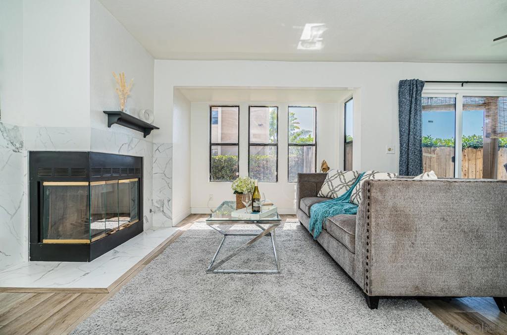 Welcome to this spacious 2 bed, 2 bath ground-level condo offering 1,070 sqf.t of comfortable living space. Nestled in a quiet location away from freeway noise, this hidden gem faces the greens of the golf course, providing peaceful views and privacy. Enjoy the rare bonus of an extended patio with 2 accessible sliding doors. The front entrance also features a cozy outdoor space that you can customize into your own little hangout nook.