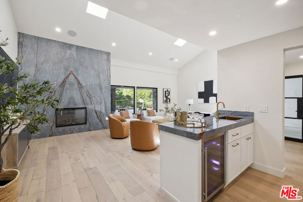 Incomparable Luxury Lifestyle & Privacy in the desirable Park Streets of Calabasas. Appreciate elevated living in this remarkable private & gated 4-bedroom, 3.5 bathroom redefined home PLUS separate ADU with it's own full bath. Meticulously updated this open, naturally lit smart residence is a sanctuary of style, comfort, & natural beauty. From the moment you enter the double door glass entry you'll be captivated by the formal living room with elevated ceilings, natural light from new windows & skylights, & the prominent fireplace. Perfect flow between entertaining in the lounge & enjoying the grandness of the living room. A large hallway offers easy flow from backyard to living room. Stylish dining room with modern lighting is located just off the state-of-the-art culinary kitchen with top end smart appliances & a considerable island with seating, plenty of storage, cabinets & counter space. This extra sized room also boast dining area situated between sliding doors to the pool & the brand-new top of the line BBQ. Up the glass staircase with chic chandelier, you'll find 4 generous bedrooms. Two serviced by a beautiful, remodeled bath & another with it's very own modernized bathroom. The primary with it's tastefully redesigned bathroom & custom closet that offers elegance & style with the large stunning sink for two & the extra-large shower. The outdoors is a welcoming oasis featuring a glistening pool, multiple lounge & dining areas to enjoy intimate gathering or large parties. The detached pool house with full bathroom, closet, & wet bar is perfect for live in guests/ office/ studio/ gym/ possible ADU with it's own HVAC The options are endless. Home offers secure gated entry, paid off solar, new roof, & drought tolerant planting. All this and a three-car garage with new doors, epoxied floors, & storage. Too many upgrades to mention. This is more than a home, it's a lifestyle of beauty, comfort, & privacy located in walking distance to the Calabasas Lake & its trails, summer concerts, & convenient location close to the Commons & it's magnitude of dining & shopping opportunities. Below Market Financing Available.