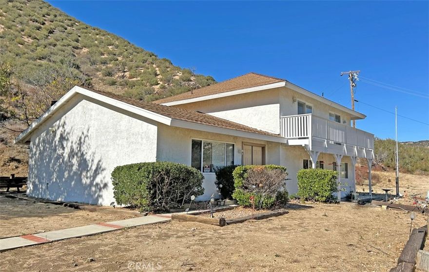 Discover the peaceful lifestyle of Lake Hughes, Don't miss this 3 bedroom, 3 bath ranch house on 11.5 acres in scenic Lake Hughes. This custom built home features vaulted wood ceilings in spacious ranch style living room with wood burning fireplace. Dream kitchen has granite counters, sub zero built-in refrigerator, tons of cabinets and a beautiful view window from the kitchen sink. Master suite has renovated master bath with double sinks and custom shower. Office or craft room could be 4th bedroom. Laundry room with utility sink has door to the outside making it a perfect 'mud room'. Zoned for horses and livestock, plenty of room for stables, a barn or workshop. Escape from the city, enjoy night skies and fresh air. Close to the quaint town of Lk Hughes and 20 minutes from Castaic.