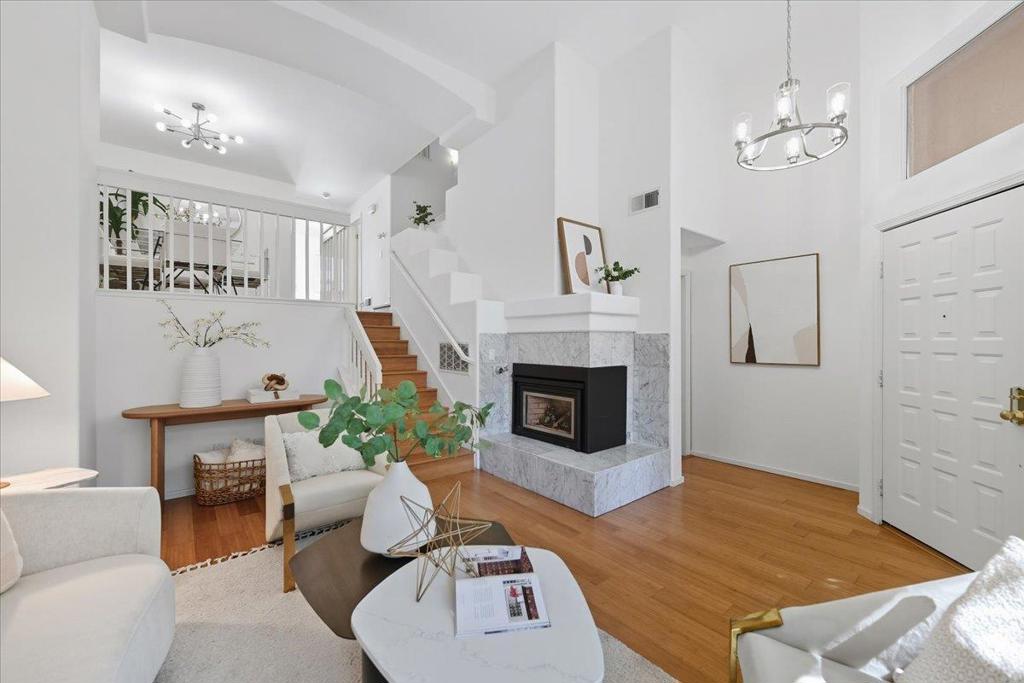 Welcome to the pinnacle of luxury living in this upgraded townhouse, ideally located in Fremonts highly sought-after Ardenwood neighborhood with access to top-rated schools. The gated front entry opens to a serene patio, leading into a bright, soaring-ceiling living space featuring gleaming hardwood floors and a cozy marble-accented fireplace. A formal dining area flows effortlessly into the eat-in kitchenperfect for everyday family meals or entertaining guests. The kitchen boasts new quartz countertops and opens to a private balcony, ideal for morning coffee or relaxing evenings under the sky. Upstairs, discover three generously sized bedrooms, enhanced with hardwood flooring and double-pane windows. The primary suite impresses with a vaulted ceiling, walk-in closet, and a spa-like ensuite bathroom with dual sinksoffering a true retreat. As part of the desirable Capriana community, residents enjoy a sparkling pool and spa, all with low HOA dues. The prime location offers unmatched conveniencewalking distance to parks including Ardenwood Historic Farm, Coyote Hills, and Karl Nordvik Park, with easy access to shops and restaurants, highways 880/84 Dumbarton Bridge, and major Silicon Valley employers. This home is truly a must-see for families and professionals alike.