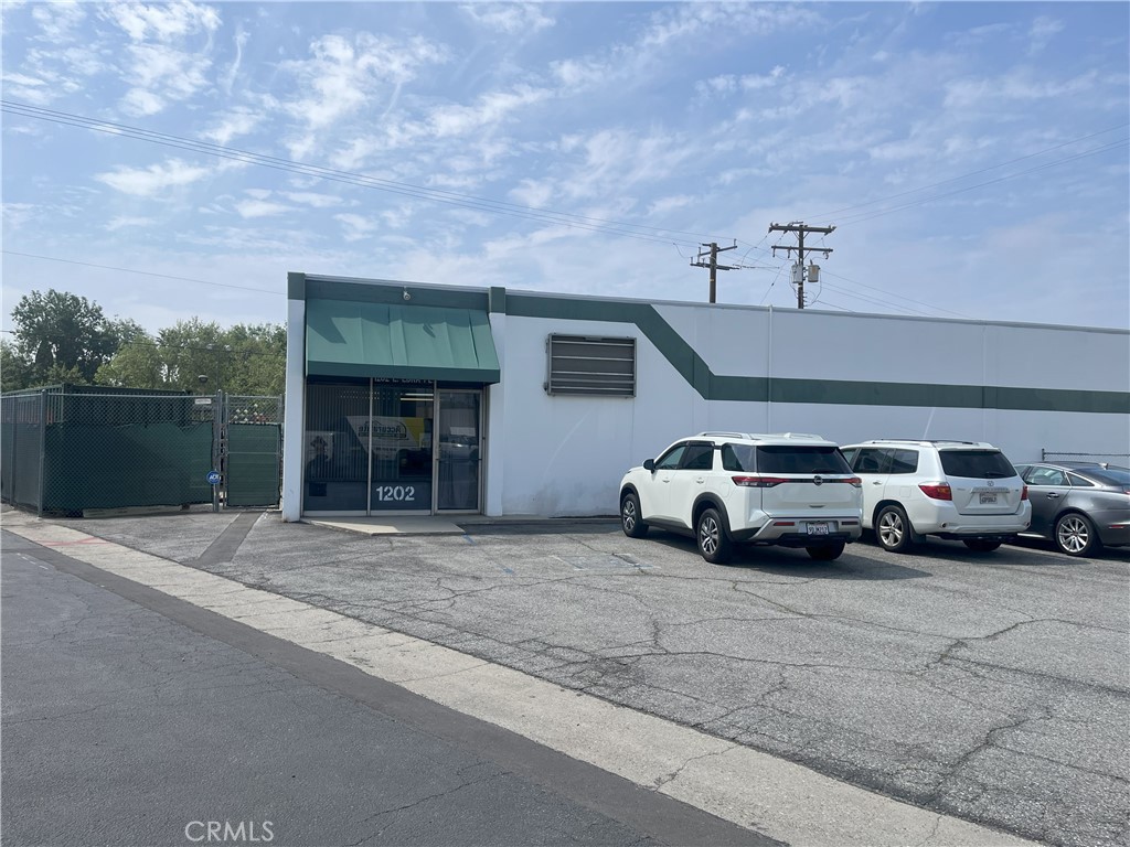 Free-standing industrial building approximately 5,264 square feet with a private fenced and paved yard area. This building has approximately 1,500 SF of office space and the balance is warehouse space. The two warehouse offices can be removed. The warehouse is vented and equipped for HVAC and would need an updated unit. The warehouse has two grade-level loading doors approximately 8'x10'. The clear height is approximately 10 feet. The power panel was recently replaced with a new 400 AMP 240V 3-Phase panel. A portion of the rear yard is covered with a metal overhang. It has a large front parking lot in addition to fenced yard.
Located along a quiet street off Cypress between Grand and Barranca. Close access to the 210, 605 and 10 freeways.