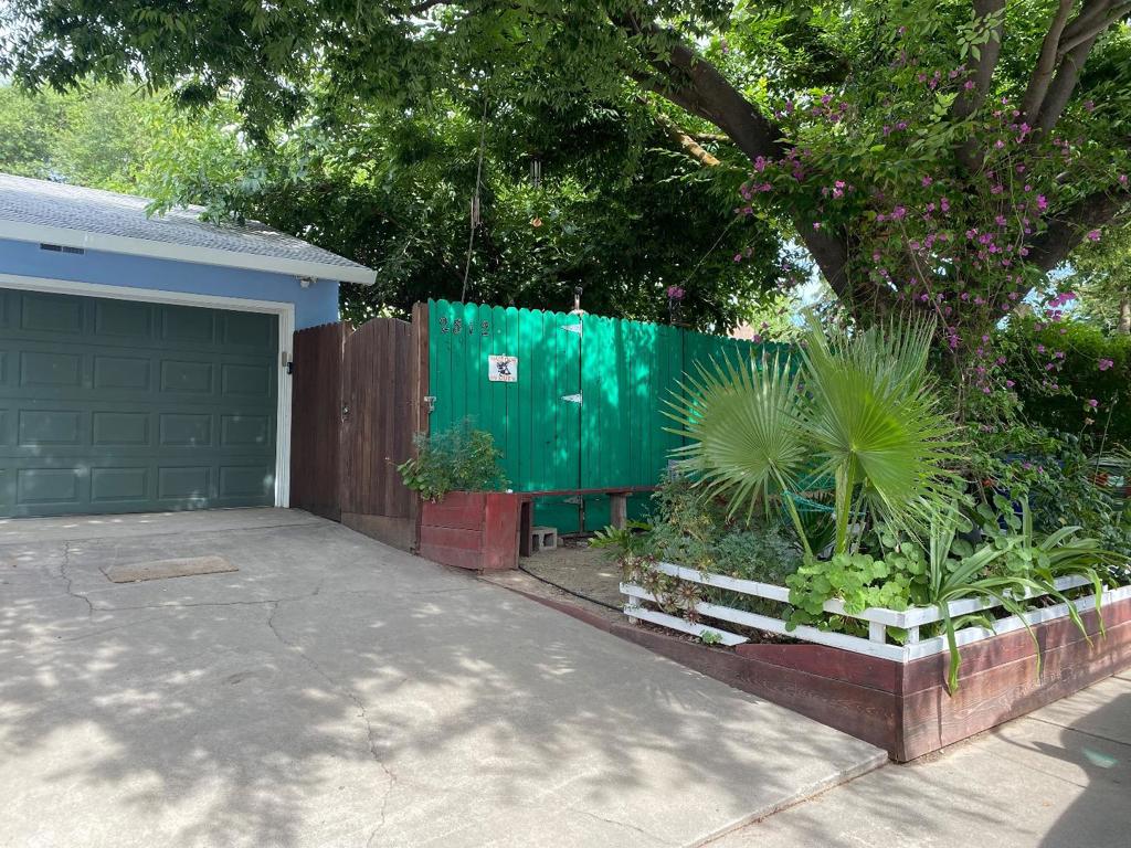 This spacious 3 bedroom, 2 bathroom home is perfect for families and those who love to entertain. The open floor plan seamlessly connects the living room, dinning, and kitchen areas, creating a welcoming space for gatherings. Enjoy a large front and backyard with lots of mature fruit trees.