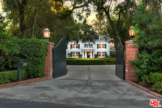 Noted developers perfectly honored the famed music legend "Smokey Robinson Estate " with a thoughtful renovation and expansion, crafting the ultimate trophy residence with unparalleled grace, and grandeur that matches Smokey's inimitable style. Grand private gates open to reveal a deep circular drive framing a symmetrical boxwood topiary garden, a timeless classic Southern Colonial façade in the distance, towering historic oak trees, and covered porches. The main residence now offers 7 bedrooms, with three en suites adjacent to the spectacular master suite, which has an apx. 800sf exterior balcony to overlook the entire property, with no neighbors in sight. Eight fireplaces, formal living and dining, state-of-the-art open kitchen, a home theater, library, and two powder rooms create ideal public space. Grounds offer a brand new pool, a lovely picnic gazebo, a running creek, and a newly built 1600sf guest house.