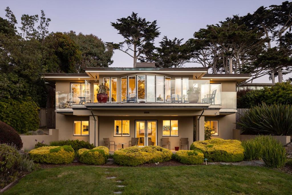 Welcome to "Spyglass". Properties like Spyglass come to market seldom. Built on a rare street-to-street spacious lot from San Antonio Avenue to the iconic Scenic Road, with front-line Carmel Beach access and the perfect orientation to ocean, beach, and golf course views. This home becomes a legacy to anyone that is fortunate enough to own it. Truly a world-class property that offers the very best of living in coveted Carmel-by-the-Sea. Owners have upgraded the flooring, appliances, all bathrooms, kitchen, generator, and exterior walkways. A remarkable floor plan offers ease of use and comfort. The primary bedroom is on the main floor, with 2 guest bedrooms below with backyard & beach access. The property has a fully secured perimeter with pedestrian gates off both streets. Spyglass is a once-in-a-lifetime opportunity!
