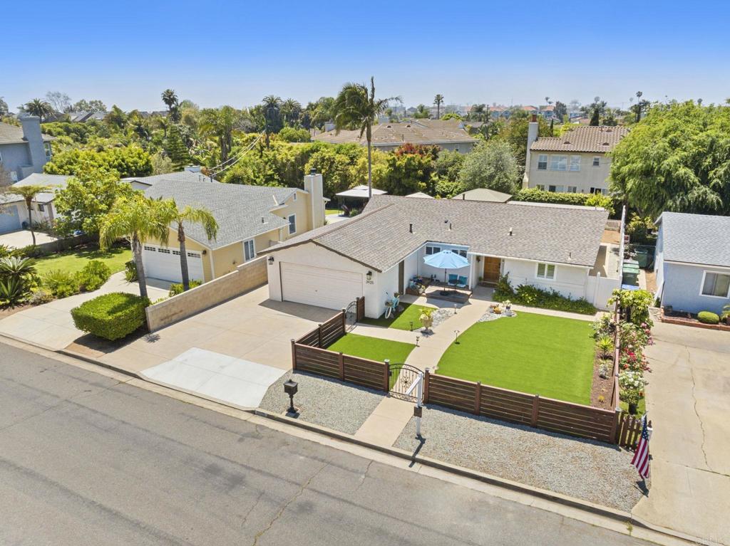 Welcome to 3925 Linmar Lane, a stunning single-story coastal retreat west of I-5 in the heart of Carlsbad, just four blocks from the sand and surf of the iconic Tamarack State Beach. This beautifully renovated 3-bedroom, 2-bathroom home spans 1,445 square feet and offers the perfect blend of modern upgrades, relaxed beachside living, and timeless charm. Step inside to an open-concept floor plan filled with natural light and a refreshing coastal ambiance. The renovated kitchen is the centerpiece of the home, featuring an expansive quartz island with bar seating, a gorgeous new backsplash, upgraded stainless steel appliances, recessed lighting and abundant cabinet storage—perfect for both everyday living and entertaining. The adjoining living and dining areas flow seamlessly, enhanced by new plantation shutters, new flooring, new double-paned windows, and a light and bright beach-inspired design. Both the primary and second bathroom have been thoughtfully updated with contemporary finishes, while each bedroom offers comfort, style, and functionality. The home is equipped with an app-controlled security system and lighting, adding modern convenience and peace of mind. Enjoy California’s indoor-outdoor lifestyle with a low-maintenance front and backyard featuring lush artificial turf, brand new fencing, a vegetable garden, flower beds, and freshly poured concrete patio space ideal for gatherings, BBQ's, lounging, and relaxation. The property also includes a 2-car garage, providing ample storage and parking. Located in a charming coastal neighborhood, you’ll be just steps away from Carlsbad Village’s vibrant restaurants, boutiques, and cafes, world-renowned restaurants, and endless opportunities to enjoy sunsets, surf, and sandy beaches. With no HOA, easy access to I-5, schools, grocery stores, Legoland, and local amenities, this home truly embodies the best of coastal living. Whether as a primary residence, a second home by the sea, or a summer retreat, 3925 Linmar Lane offers a rare opportunity to live the Carlsbad lifestyle at its finest.