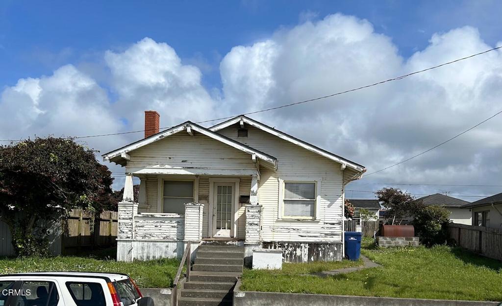 Just moments from downtown, the main house offers 3 bedrooms and 1 bathroom, dining room and spacious laundry room. Additionally a separate 1 bedroom, 1 bathroom ADU with independent utility connections provides flexibility and privacy. Although it needs updating and work, this property offers endless possibilities for the right buyers. Explore the potential of this fixer-upper with distant ocean views and make this your opportunity to create your dream home.