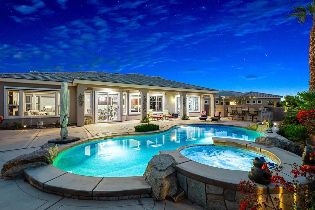 Welcome to the only Juniper floorplan in Trilogy La Quinta with a detached guest casita--an exceptional and rare offering in this premier 55+ active adult community. Situated on an elevated 12,632 sq. ft. premium lot overlooking the 5th tees of the championship golf course, this beautifully upgraded 2,979 sq. ft. home features four bedrooms and 4.5 bathrooms, including a private detached casita perfect for guests, multigenerational living, or a home office. The open-concept design features a spacious great room, an elegant dining area, and a gourmet kitchen, ideal for both everyday comfort and entertaining. Step outside to a resort-style backyard with a private pool and spa, built-in BBQ, and cozy fire pit--all positioned to capture panoramic fairway and mountain views and stunning desert sunsets. The expansive covered patio and lush landscaping create a serene retreat for relaxing or entertaining under the stars. Inside, enjoy upscale finishes, a luxurious primary suite with a spa-inspired bath, and a 3-car garage offering ample storage. Located on a quiet cul-de-sac, this home provides easy access to Trilogy's top-tier amenities, including golf, tennis, pickleball, a fitness center, resort-style pool, on-site dining, and an active calendar of events and social clubs. This one-of-a-kind property offers the perfect blend of privacy, luxury, and community--an unmatched opportunity to enjoy the very best of desert living.