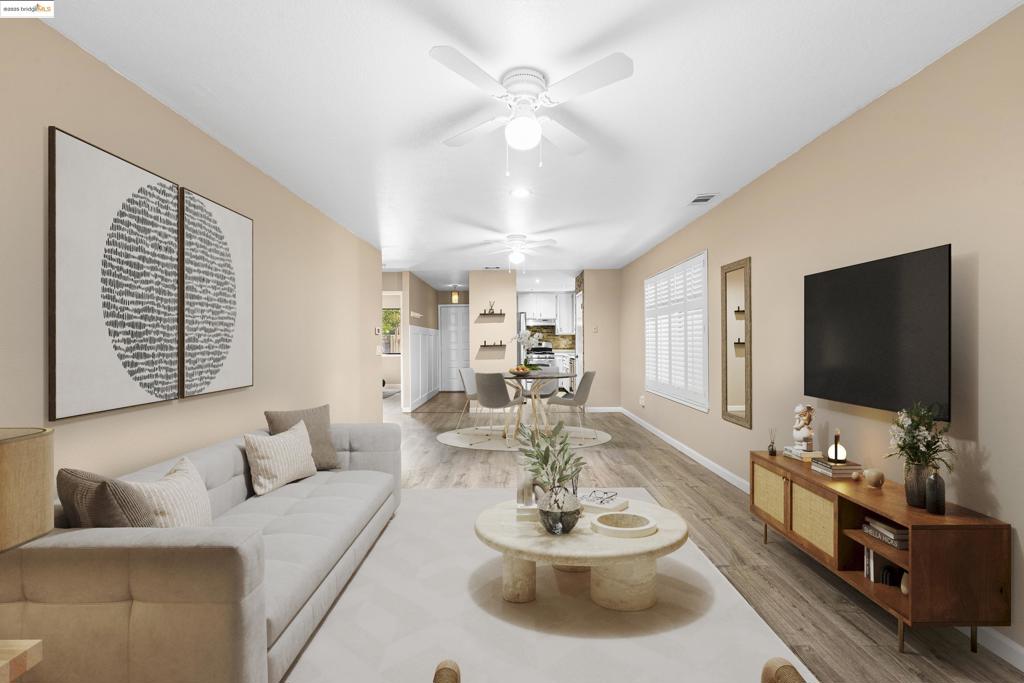 Discover this private one-story end unit, tucked away at the back of a beautifully maintained complex. Filled with natural light, the home features an inviting open layout, a tiled fireplace, and a convenient in-unit laundry room. Step outside to a peaceful patio with a serene tree-lined backdrop or enjoy a dip in the community pool. The unit comes with a parking spot and detached garage. Enjoy the best of both worlds—easy access to Hwy 12 while still enjoying quiet, private living. Property virtually staged.