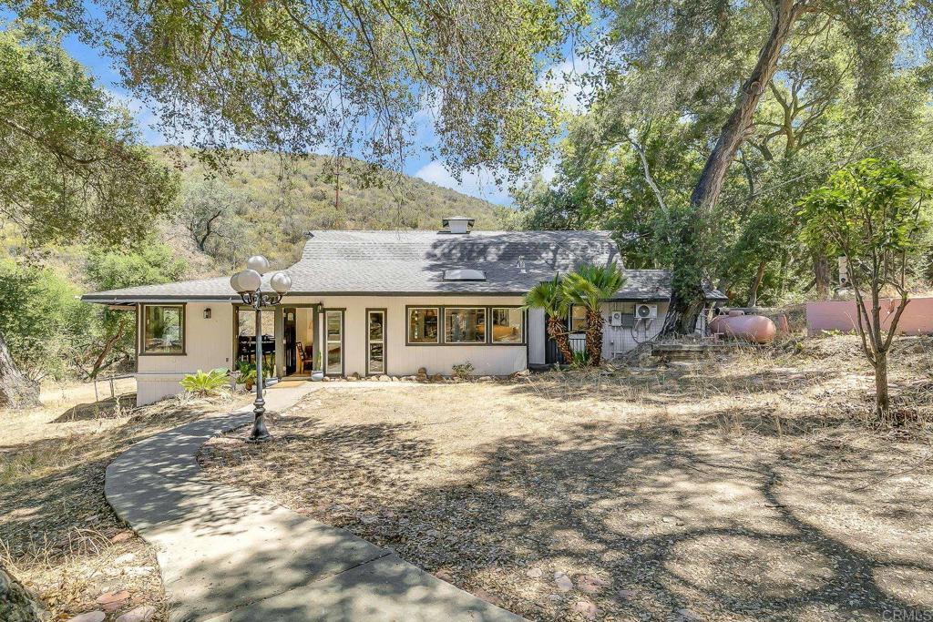 Looking for peace, space, and a little slice of country life? You’ve found it! This cozy spot in Valley Center sits on over two acres of flat, usable land, perfect for gardening, animals, playing outside, or just enjoying the open space. A seasonal creek runs behind the house, and there's even a pad already in place if you’ve been dreaming of starting an Airbnb or building a guesthouse. Plenty of room to spread out and make it your own. Take a look at the photos, We’d love to show you around!