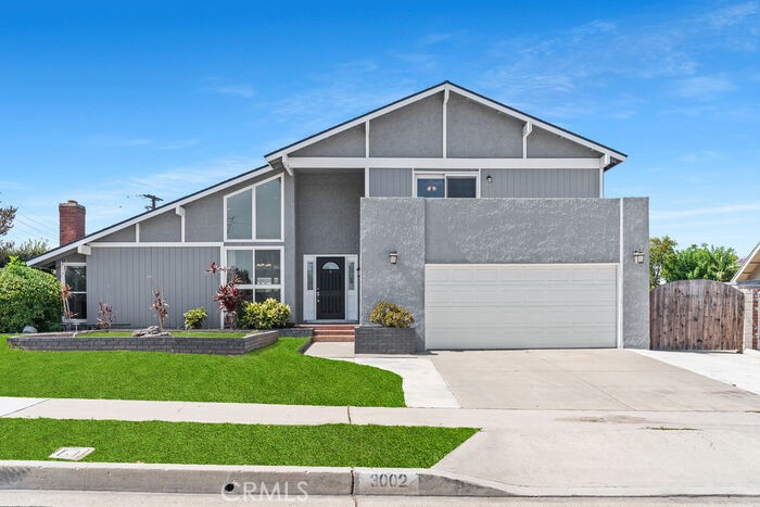 Situated on a sprawling, nearly 12k sq ft corner lot, this 5 bedroom, 3 bath home in the Villa Park HS district offers a fantastic floorplan with plenty of space for entertaining, both inside and out. Enjoy double-height cathedral ceilings, a unique sunken conversation area around the living room fireplace, beautiful wood floors, and a dining room that opens to a newly built deck—ideal for alfresco meals.
The spacious chef’s kitchen features upscale cabinetry, granite countertops, and opens to both the dining room and family room, creating a seamless flow. The family room leads to the expansive backyard, which is beautifully landscaped and offers ample room for a potential pool, ADU, play area, or garden retreat. Just off the family room is a hallway leading to a private bedroom, a full guest bath with a shower, and access to the two-car garage, which includes built-in storage, washer/dryer hookups, a utility sink, and a door to the side RV parking area.
Upstairs, you’ll find four additional bedrooms. Updated bathrooms include a full hall bath with a tub. Bonus feature: a laundry chute from the second floor linen closet! The spacious primary bedroom includes double closets and opens to a charming front balcony—perfect for your morning coffee.
Great neighborhood, ideal for entertaining, multi-gen living, or adding future value, in a highly sought-after school district—this home truly has it all. Come take a look!