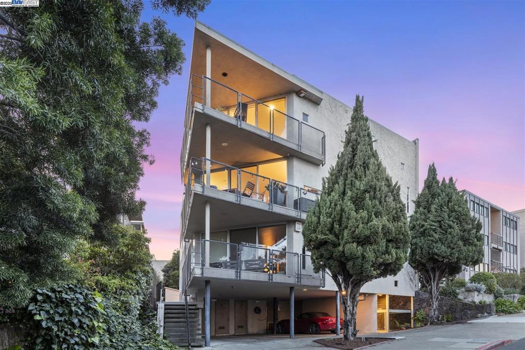 Tucked into a boutique, mid-century, elevator building with just three units, this nearly 1,700-square-foot, unique condo lives more like a single-family home. The main living area's floor-to-ceiling windows make their statement. Natural light floods the open-concept space, where a beautifully updated kitchen flows seamlessly into the dining and living areas. You'll love the indoor-outdoor feel that comes with your own view balcony, large enough for sipping coffee or hosting dinner parties. The ample primary suite includes a renovated bath as well as a sizable bonus room that adapts to however life unfolds—home office, exercise space, playroom, creative studio. Two more bedrooms and a full bath complete this zone of the home. Central A/C, an EV charger and in-unit laundry round out the amenities that make daily life effortless. And SB326 balcony and stair work is complete, so you can focus on enjoying your new home. This home is perfectly positioned in Adams Point's sweet spot—Lake Merritt's Saturday Farmers' Market becomes your weekend ritual, Grand Lake's dining scene is your backyard, and both Whole Foods and Trader Joe's solve the grocery equation. It's the kind of Oakland address that delivers equal doses of urban convenience and neighborhood charm.