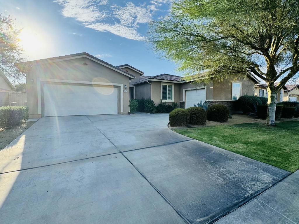 Beautiful single-story home in the gated Desert Trace community! Located on a quiet cul-de-sac, this spacious residence offers an open-concept floor plan with a light-filled living room, dining area, and chef's kitchen featuring granite countertops, a large island, and stainless steel appliances. The private primary suite includes a spa-like bath with dual vanities, soaking tub, and walk-in closet. Additional bedrooms are generously sized, perfect for guests, family, or a home office. Enjoy the private backyard with plenty of room for entertaining or adding a pool. Desert Trace offers a secure, family-friendly setting with low HOA fees and a prime location near schools, shopping, dining, and world-famous festivals. Easy access to I-10 for quick trips to Palm Springs, La Quinta, and beyond.