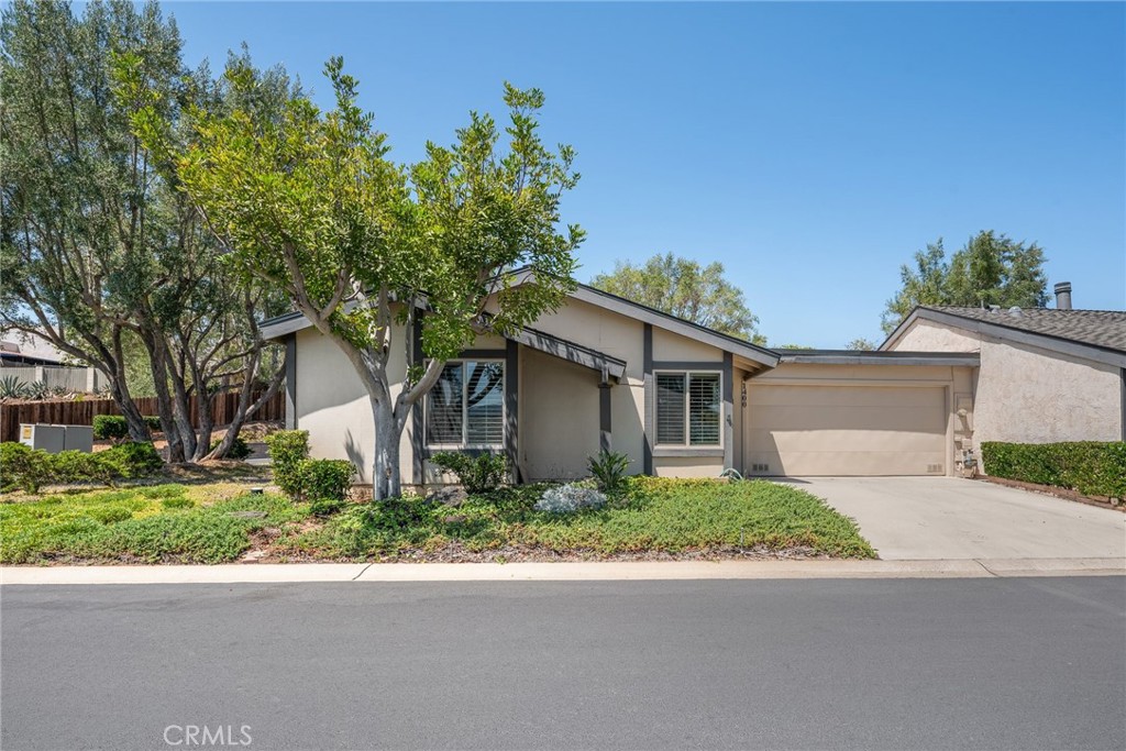 This charming unit is the largest remodeled home in a quiet 55+ community, complete with a variety of thoughtful upgrades that enhance both style and comfort. Newer windows with plantation shutters, and removal of popcorn ceiling throughout. A kitchen outfitted with granite countertops, maple cabinets, and an ultra-useful garden window for extra counter space or a sunny spot for plants. The master suite boasts a cathedral ceiling, mirrored closet doors, and a master bath with tile flooring and a walk-in glass block shower for ease of access. Additional luxury touches like skylights that brighten the space naturally, updated lighting fixtures, and a newer built in entertainment center are included. The dining area stays breezy and bright, opening via slider to an inviting brick patio. The home is within steps to the clubhouse, community pool and spa, mailbox, and guest parking. This home has an amazing location, and everything you could want for your retirement.