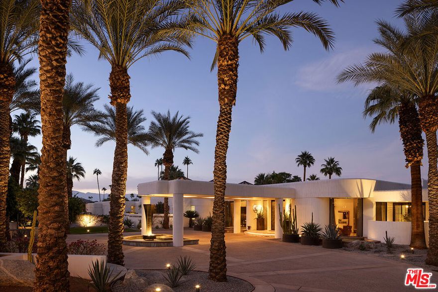 Welcome to a show-stopping estate in the heart of Thunderbird Heights that defines luxury desert living. Expertly built and beautifully designed, this unforgettable 9,265 SQ FT compound sits on approx. 1.2 acres of pristine, meticulously landscaped grounds. The main residence features 2 bedrooms and 5 bathrooms, complemented by a separate 2BD/2BA stand-alone casita for ultimate privacy. From the moment you arrive, the property makes a statement: a circular driveway, fountains, desert gardens, and a dramatic porte-cochre entrance set the tone. Through the double etched-glass doors, grand-scale interiors unfold with soaring ceilings, warm natural materials, and a seamless blend of sophistication and comfort.Every bedroom opens to a private patio, and every detail is thoughtfully executed, from the four-car air-conditioned garage with stretch-limo capacity and epoxy floors, to multiple covered patios, misters, and expansive entertaining areas including a full outdoor kitchen, cabana, bar, and an additional 3/4 bath. The interiors are elegant and expansive, offering a formal living room with fireplace and mahogany coffered ceilings, a custom sunken wet bar, formal dining room with floor-to-ceiling windows, wine closet, family/media room, library, hidden back office, and art studio. The chef's kitchen is exceptional, with double appliances, custom cabinetry, and a full butler's pantry. The detached casita is ideal for guests, featuring its own living room, kitchenette, and two en-suite bedrooms. The oversized primary suite is a true retreat with a sitting area, fireplace, spa access, and dual his-and-hers bathrooms complete with steam shower, jetted tub, multiple walk-in closets, and a private gym or massage space.Outdoors, the property transforms into a private desert oasis with a saltwater pool, waterfalls, two spas, sculpture gardens, and sweeping mountain views. Security cameras cover all three gated entrances, and the home also offers owned solar. A celebrated estate within Rancho Mirage, this property once hosted the "Opening Night" of the historic Thunderbird Country Club during its major renovation with a sit-down dinner for 300 showcasing its unparalleled capacity to entertain. Enjoy private tunnel access to Thunderbird Country Club, the first private golf club in the Coachella Valley, located just moments away. Elegant, iconic, and truly one-of-a-kind this is a home that stays with you.