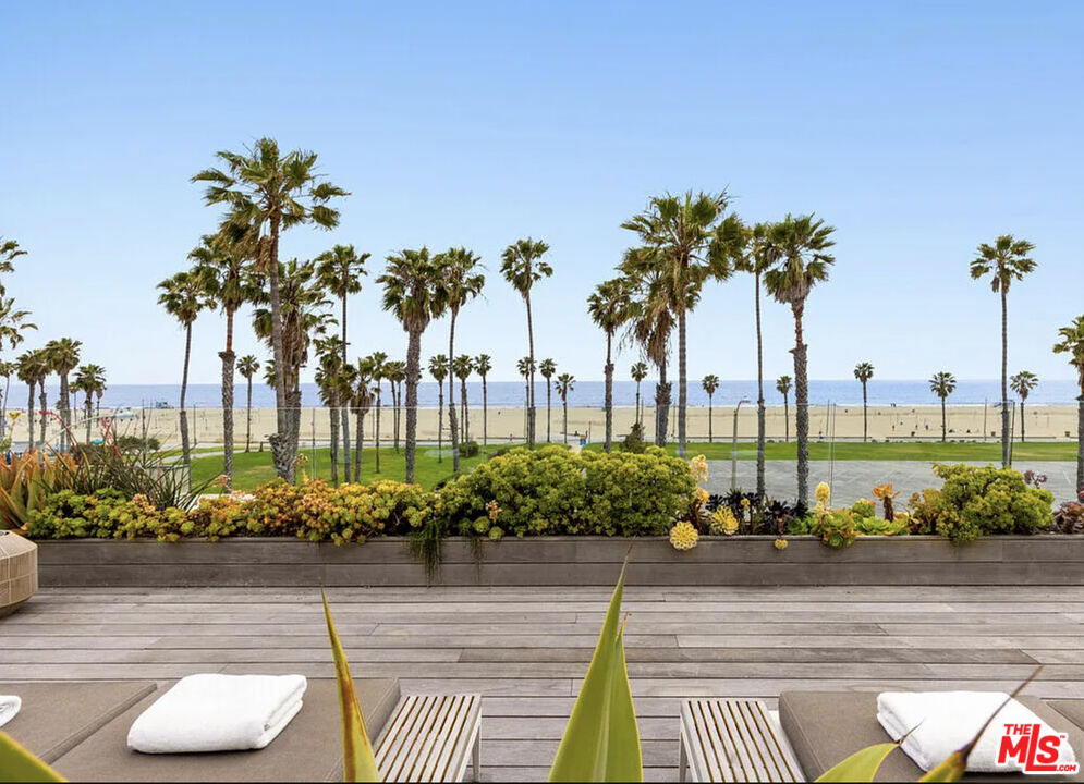 Experience the epitome of coastal living at 120 Hart Ave. Enjoy captivating, direct ocean views from the comfort of your home while being ideally situated on Santa Monica's desirable walk streets, just moments away from the sandy beach, and all of Santa Monica's iconic offerings. This luxurious FULLY FURNISHED beachside retreat was taken down to the studs and rebuilt in 2022 with the highest quality, craftsmanship and design. The home boasts breathtaking ocean views spanning from Catalina to Malibu, while experiencing privacy at its finest. Discover an expansive state-of-the-art Henry built kitchen featuring a Lacanoche stove, bespoke cabinetry, and a large center island. Adjacent, find an outdoor deck conveniently fit with a pizza oven and Wolf barbecue. No detail was spared with two Subzero refrigerators/freezers, dual Cove dishwashers, a Miele espresso machine and a Uline wine fridge. The adjoining open-concept living and dining area is designed for entertaining or relaxation while soaking up the palm trees and ocean view. Floor-to-ceiling windows flood the space with natural light which compliments the warmth of the walnut Madera floors, creating an unrivaled seaside sanctuary. The lavish primary suite highlights exquisite custom cabinetry, walk-in closets and an adjacent spa-inspired bath. Retractable glass doors open to a lush, private outdoor oasis complete with a modern fireplace, outdoor shower and built-in cold plunge and hot tub. The home presents three additional en-suite bedrooms, five bathrooms, a cutting-edge home office and gym (optional fifth bedroom). Throughout the home, find Electric Lutron shades providing utmost privacy and convenience as well as an elevator granting access to every level. The vast 1,500-square-foot rooftop deck is where an entertainer's paradise awaits. Bask in the panoramic views of the Pacific coastline while soaking in the marvelous plunge pool or indulge in alfresco dining amidst the endless amenities such as a Wolf barbecue, refrigerator, custom tailored awnings, Tucci umbrellas, heaters, fire pit and an expansive lounge and dining area. A perfect location to end each day while admiring the stunning sunsets. A spacious four-car garage, dedicated laundry and mud room complete the home. Enjoy unparalleled access to the beach and Main Street's coveted dining and shops by making this coastal retreat your next home.