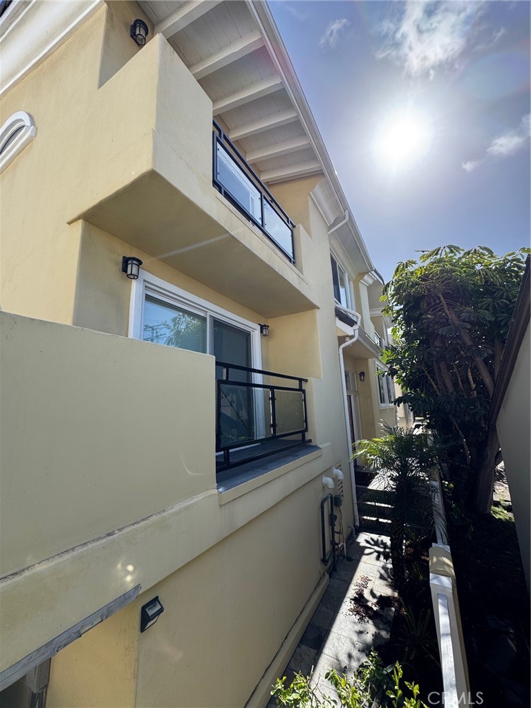 Great location, Walker’s Paradise only  two blocks from the ocean & walking distance to Riviera Village. (91 Walk score) Free standing rear unit with small rear yard (patio). Perfect floor plan for entertaining .  Automatic gate in rear, smooth stucco on exterior, stone on walkways & exterior patio. Split levels, 2 car garage with acid stain finish and electric car charging outlet, exercise room, huge large laundry room new washer and Dryer with lots of cabinets and counter space including sink, two large closets in hallway. Double door entry with vaulted ceiling. Wood floors  throughout 3 BRS on entry level & 2  baths &  Family room with fireplace , balcony, & oversized wet bar. Top floor living room with fireplace, balcony with ocean peak views, and formal dining room. New kitchen, stainless steel appliances including fridge & wine cooler, Guest bath, main bedroom with balcony, vaulted ceilings, ocean peak, walk in closet & remodeled bath with huge linen closet. Central Air and heat, all bathrooms with with bidet toilet seats.Top-rated schools including (Tulita Elementary School) Major  remodeling was just completed