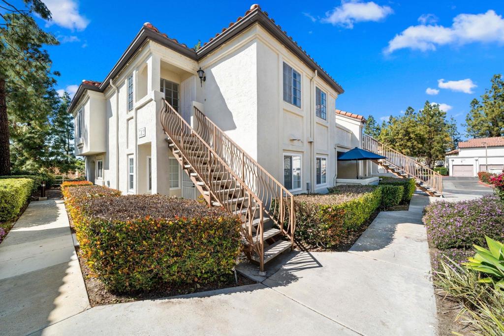 SELLER WILL PAY 1 YEAR HOA FOR THE BUYERS. This community has a lot to offer and is the perfect place to host friends and family year-round while enjoying Southern California weather. No need to look for weekend plans when your community has it all?! soak up the sun as you paddle boat, canoe or just take a stroll around the gorgeous community lake, which is stocked with fish and turtles for your enjoyment. The lake is the perfect tranquil place to either start or end your day. Choose from 4 community swimming pools to lounge and have the perfect outdoor barbeque. For those who like to stay active, take your pick on what to play! You have access to tennis, volleyball and basketball courts! There are playgrounds for kids of all ages and clubhouse centers for any social gathering you need. Feel confident in the local award winning schools and you're also located conveniently near desirable shopping centers which include popular restaurants and local favorite eateries. This totally upgraded upstairs unit offers a remodeled kitchen with quartz countertops, stainless steel appliances. This home also features 2 master bedrooms with totally beautifully upgraded bathrooms, wood laminate flooring throughout, modern light fixtures and a convenient digital Nest thermostat to control your home climate wherever you are. Private balcony for all your family gatherings. Comfortable laundry closet with in-unit washer/dryer hookups, and the home comes with 2 dedicated parking spaces - 1 assigned spot and a detached garage. Don’t miss the opportunity to make this stunning Villa Martinique townhome your own!.Photos represent the property when it was staged. Property is now VACANT and new carpet has been installed in the living/sleeping areas.