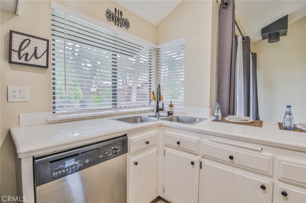 Welcome to Lakeridge community, upstairs unit 94 is very well maintained with beautiful views of the streams & waterfalls throughout the complex. Spacious living room with a sliding door to the patio overlooking a tranquil stream. The bedroom has a murphy bed and a sliding glass door to the patio with a view of the tennis courts. Skylight near the walk-in closet and bathroom vanity, shower-tub combination and stackable washer and dryer hook ups in a closet. The unit is near the gate entrance, faces the tennis courts and is in move in condition. Conveniently located near 60 and 605 freeways, dining & shopping in uptown Whittier and Rio Hondo College close by.