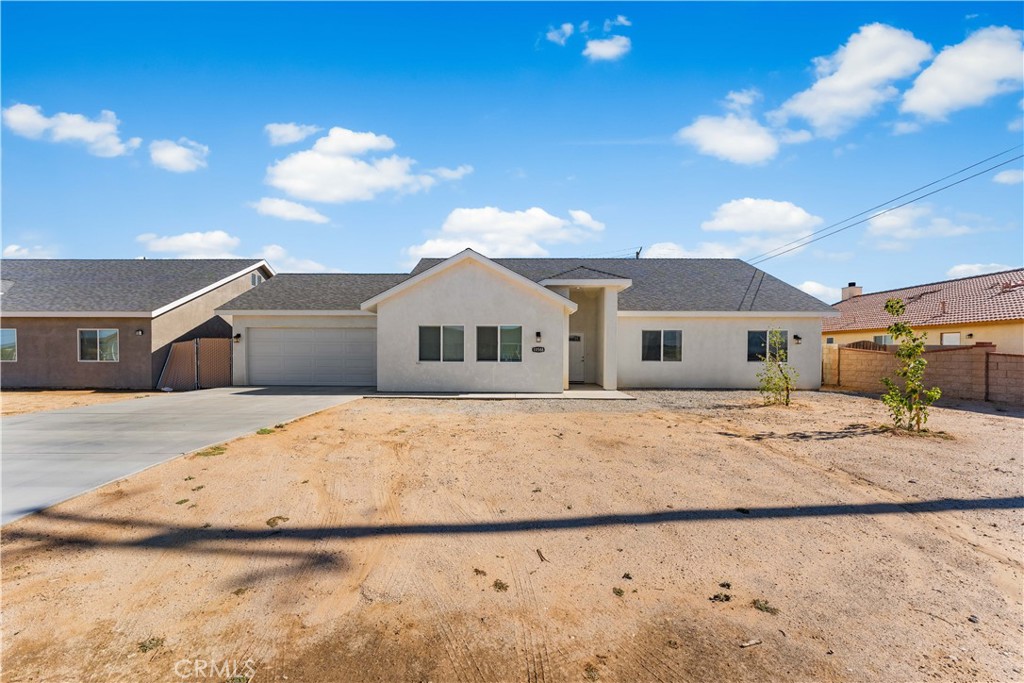 Welcome to this beautifully upgraded 4 bedroom, 2.5 bathroom home built in 2022, offering 2,137 sq. ft. of living space on a spacious 10,018 sq. ft. lot. Designed with comfort and modern living in mind, this home combines thoughtful features, energy efficiency, and plenty of room inside and out. The open floor plan creates a seamless flow from the living area to the kitchen and dining space. The kitchen is well equipped with quartz countertops, stainless steel appliances, a walk-in pantry, and a stone wrapped island with seating. In the living room, a custom fireplace with a marble backsplash adds style and warmth, making it the perfect gathering spot. Recessed lighting throughout brightens every corner of the home. Solar panels, 220 amp electrical service, propane gas, and city water. These upgrades not only add value but also keep the home efficient and reliable. The backyard is set up for both relaxing and entertaining. A covered patio with concrete flooring and artificial grass create a low maintenance setting, while the outdoor island with seating is perfect for BBQs and gatherings. A cozy fire pit, a convenient shed, and the spacious lot make it the ideal space for outdoor enjoyment. With over 10,000 sq. ft. of land, there's room to add a pool, an ADU, or expand your outdoor living area. This home has it all style, space, and possibilities.