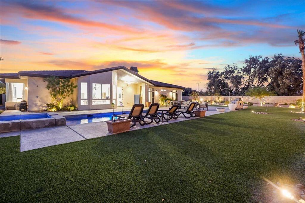 Welcome to your ultimate desert retreat! This custom-built, 7-bedroom, 3.5-bath home sits on over an acre of private, gated land, offering incredible mountain views and city lights. Recently remodeled in 2020, the estate is turn-key furnished and ready for your family or group to enjoy.The expansive backyard features a newly redone pool, jacuzzi, beach volleyball court, and RV parking. Designed for fun and relaxation, the home also boasts an attached casita/game room and a dedicated movie room for endless entertainment.Each bedroom is spacious and comfortable, making it ideal for large groups. The open floor plan seamlessly connects the living, dining, and kitchen areas, creating a perfect space for gatherings and celebrations.Whether you want to relax by the pool, play volleyball, or host a movie night, this estate offers everything you need for an unforgettable stay. With no immediate neighbors, you'll enjoy ultimate privacy while soaking in the desert lifestyle. Perfect for family get-togethers or a fun group getaway, this retreat truly checks all the boxes for a dream vacation. Book now for an unforgettable desert escape!Rates are subject to change. All stays are 30 days minimum or longer unless stated otherwise. Information provided is deemed reliable but interested parties must verify all related to square footage, utilities, etc. Investments carry risk including of your principal.