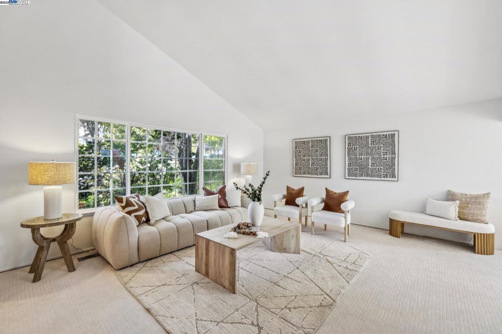 Nestled in the peaceful Hayward Highlands, this beautifully updated split-level home, with no rear neighbors and a stunning canyon backdrop, invites you to relax and unwind in your own private retreat. Step inside to soaring vaulted ceilings and expansive picture windows that flood the living space with natural light. The formal living room flows effortlessly into the dining area, which opens to a sunroom, leading to the upper deck with sweeping canyon views. The updated kitchen features stone countertops, stainless steel appliances, and warm wood cabinetry, perfectly designed for the home chef. Fresh interior paint and brand new carpet throughout create a move-in-ready feel. The lower level offers flexibility and privacy, complete with a bedroom and full bath, a laundry room, a cozy family room with a brick fireplace, and a wet bar that opens to the spacious backyard deck. Upstairs, the primary suite boasts a charming bay window overlooking the lush canyon, along with an updated en suite bathroom with a walk-in shower and a bidet. Two additional bedrooms and a full hall bath complete this level. Other highlights include a paver driveway, solar panels, and a low-maintenance front yard with mature landscaping.