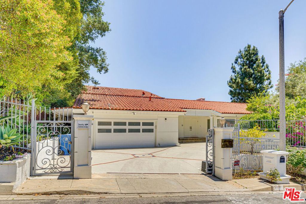 Beautiful upper Bel Air 2-story 4 bed/3.5 bath (furnished or unfurnished) updated Contemporary Spanish with sweeping panoramic canyon, reservoir and gorgeous sunset views. Privately gated front yard and driveway with additional parking leads to double doors that open to formal entry and beautiful open floor plan filled with natural light. Great room with vaulted ceiling, double sided fireplace and wall of windows with 2 sliding doors to entertainer's backyard with pool and spa, large deck and covered outdoor living room and kitchen with with built-in BBQ and granite countertop serving area, 2 refrigerators including wine fridge, ceiling fan and large dining and seating areas. Dining room with fireplace and access to deck, pool and canyon views, opens to modern kitchen with granite countertops and stainless Miele steel appliances including built-in coffee maker, breakfast bar and side yard access. 2 bedrooms down including spacious primary suite with fireplace, walk-in cedar closet beautiful canyon views and ensuite updated full bath with dual basins, separate bath and shower. 2nd bedroom front facing with bay window and bench and ensuite updated bathroom. Upstairs is an additional 2 bedrooms each with ensuite bathroom with a second primary suite option with sliding door to private balcony with views and ensuite updated bathroom. Additional features include contemporary flooring downstairs and hardwood flooring in 2 upstairs bedrooms, central ac/heating, recessed lighting, alarm system, all bedrooms with updated ensuite bathrooms. and inside laundry room. Enjoy entertaining poolside and taking in the tranquil sunset views on one of the finest view streets in Bel Air.