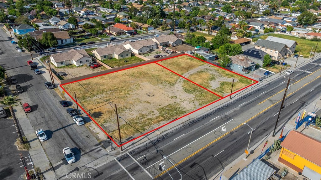 Exceptional opportunity to own a highly visible corner commercial lot just a quarter mile from the I-215 freeway. Spanning a combined 29,572 square feet across two contiguous parcels, this property offers outstanding potential for a wide range of commercial uses. With approximately 218 feet of street frontage, the site provides excellent exposure and accessibility, ideal for drive-thru, office, retail, service-oriented businesses, or future