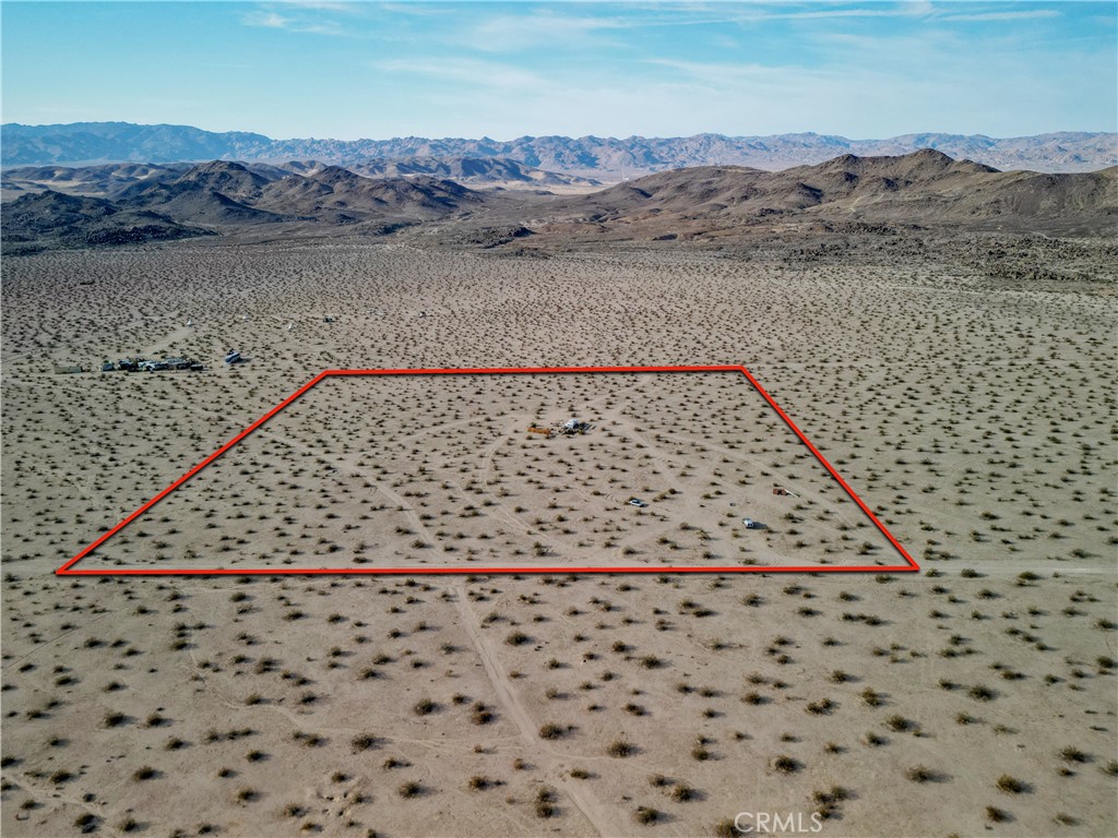 Own 10 acres in Joshua Tree and finally have the space to do all the things your neighbors would call the HOA on you for. Build a house, camp under the stars, or just tell your friends you own a piece of desert paradise and watch them get jealous. The property has access to the local water company, but you’ll need to call the city to find out what it costs to hook up. Views of the desert and mountains come free of charge, and at night you’ll get a sky full of stars that beats any screensaver. Close enough to town for coffee and tacos, but far enough away that the only traffic you’ll see is a jackrabbit hopping by. Snag it before someone else does and turns it into a yoga retreat.
APN#0632-111-21-0000
Coordinates: 34.211037 / -116.215303