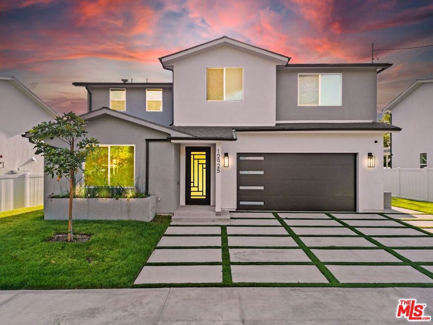 Brand new construction in Sylmar! This modern 5 bedroom, 3 bathroom home offers 2,540 sq ft of bright open living with high ceilings, designer engineered wood floors, and a custom steel entry door. The kitchen features quartz counters and stainless appliances, and each bedroom is generously sized with great hill views. A bold wood accent wall elevates the living area, and the private backyard with new landscaping and a patio creates the perfect outdoor retreat. This turnkey home delivers style, space, and comfort on a pride of ownership street with new development happening throughout the area.