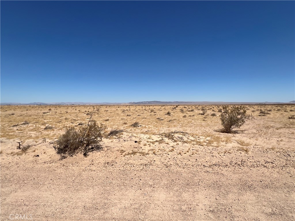 Serene 4.27 acre lot located in Newberry Springs. Rural living and desert scenery with views of nearby mountain ranges, provides a peaceful landscape. Build your dream and enjoy the tranquility of starry nights and beautiful desert sunrises. There are nearby properties turned into family compounds with private lakes and multiple homes. This property is located off of Palm Vista Rd, within 1000 Ft of the overhead high voltage power line at the corner of Fremont Rd and Palm Vista Rd. Homes in this area utilize wells for water, propane tanks for gas needs, and septic tanks for sewer needs. The RL-5 Rural zoning allows for residential, agricultural, and other potential uses. Check with San Bernardino County for all potential uses. Buyer to verify any potential uses, boundaries, zoning and utilities. Address is for marketing purposes only, this property does not yet have an assigned address. GPS Coordinates: Latitude 34.917096 / Longitude -116.623633.
