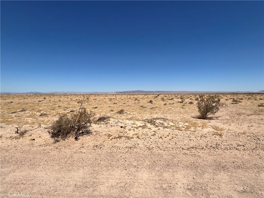 Serene 4.27 acre lot located in Newberry Springs.  Rural living and desert scenery with views of nearby mountain ranges, provides a peaceful landscape.  Build your dream and enjoy the tranquility of starry nights and beautiful desert sunrises. There are nearby properties turned into family compounds with private lakes and multiple homes.  This property is located off of Palm Vista Rd, within 1000 Ft of the overhead high voltage power line at the corner of Fremont Rd and Palm Vista Rd.  Homes in this area utilize wells for water, propane tanks for gas needs, and septic tanks for sewer needs.  The RL-5 Rural zoning allows for residential, agricultural, and other potential uses.  Check with San Bernardino County for all potential uses.  Buyer to verify any potential uses, boundaries, zoning and utilities.  Address is for marketing purposes only, this property does not yet have an assigned address.  GPS Coordinates: Latitude 34.917096 / Longitude -116.623633.