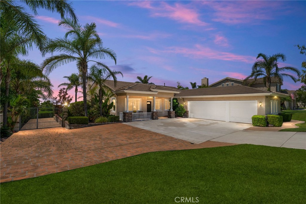 Welcome to your single-story slice of paradise in the heart of Rancho Cucamonga! This 4-bedroom, 2-bath beauty sits on a generous 13,600 sq ft lot and offers the perfect blend of elegance and easy living. Inside, you’ll find warm wood floors, plush carpet in the bedrooms, a cozy fireplace for those cool evenings, and a light-filled kitchen with sleek quartz countertops and stainless-steel appliances. The 4th bedroom offers versatility, making it perfect for a home office, hobby room, or guest space, tailored to fit your needs. Out front, you’ll be greeted with stunning foothill vistas framed by swaying palm trees and a charming front porch perfect for morning coffee. The oversized 3-car garage gives you plenty of room for parking, storage, or weekend projects. Step out back to your private entertainer’s dream with a spacious covered patio and built-in BBQ, lush landscaping, and sweeping city lights views. Thoughtful upgrades include a brand-new roof in 2024 and Milgard windows installed in 2021 for style, comfort, and energy efficiency. Located less than a mile from Victoria Gardens, this home is in a neighborhood known for Blue Ribbon schools, walking trails, friendly neighbors, and a safe, welcoming vibe. Whether you’re downsizing, starting fresh, or simply looking for a peaceful retreat, this home checks all the boxes.