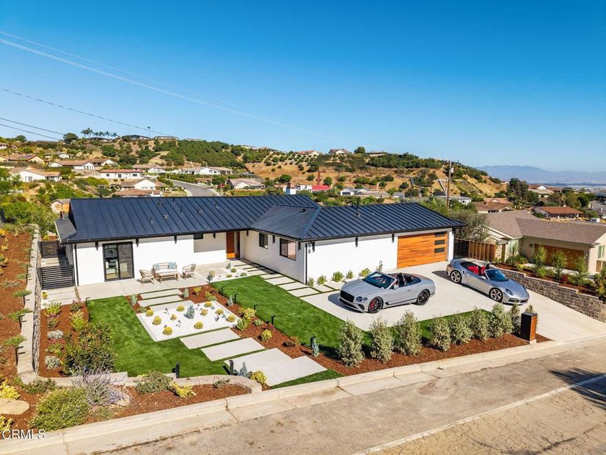 Discover unparalleled living in this meticulously remodeled 4-bedroom, 3-bath home, where every detail has been thoughtfully updated. The exterior showcases a durable metal roof and new stucco, ensuring both curb appeal and longevity. Step inside to an all-new interior, from the modern kitchen with its high-end appliance, waterfall island to the majestic fireplace, Custom cabinetry stylishly appointed bathrooms, including a water room and a convenient, dedicated laundry room.Think economics with new windows, doors, electric panel, HVAC, a/c, automatic shades and car charger.The beauty of this home is a rare art piece. Every detail has a significant personal detailed touch.The outdoor spaces are just as impressive. A beautiful new gazebo sits within the tiered landscape with sprinklers and lighting creating an ideal spot for relaxation, and outside kitchen for the ultimate in alfresco dining & entertaining. Full size Olive, avocado, persimmon trees, beautifully finished concrete stairs and iron fencings round the brick tiered yard. The elevated location provides spectacular, sweeping views of the city lights, the Pacific Ocean, and the majestic mountains. The oversized lot will allow for many activities and friendly gatherings. Parking driveway was expanding for four cars. Coming home every day will be a joy.  As a bonus, an optional Ondulando Club membership is available, offering a community hub with a pool, pickleball. Living the Hillside life with space to grow and unparalleled views in a like new home might be just what you need...Come by for the list of upgrades.
