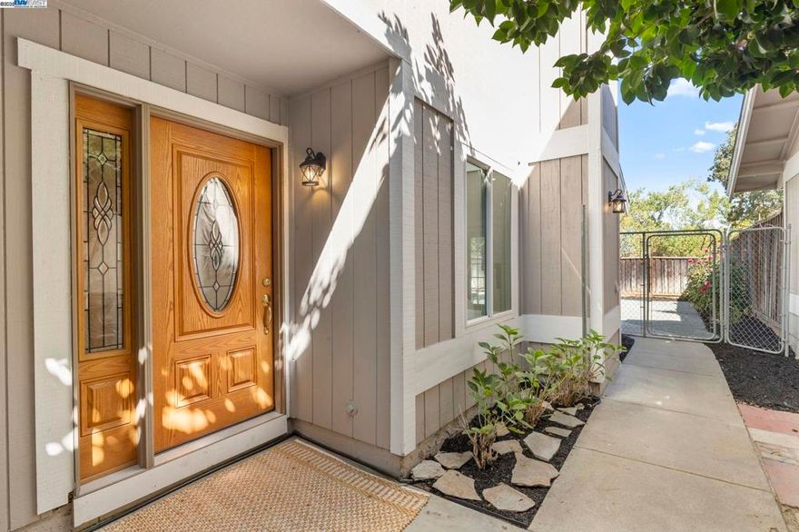 Charming Duet Near Downtown Pleasanton  This beautifully updated 3-bedroom, 2.5-bath duet offers the perfect blend of comfort, style, and convenience. Tucked away at the end of the street, the home features a brand-new kitchen, updated bathrooms, and fresh finishes throughout. Enjoy tile flooring downstairs and new carpet upstairs for a stylish and functional layout. Modern smart home features add convenience and efficiency to everyday living.  The spacious design flows seamlessly to a newly landscaped backyard that backs up to peaceful open space—ideal for entertaining or relaxing in your private retreat.  Located just minutes from downtown Pleasanton, local parks, and top-rated schools. This home truly has it all.