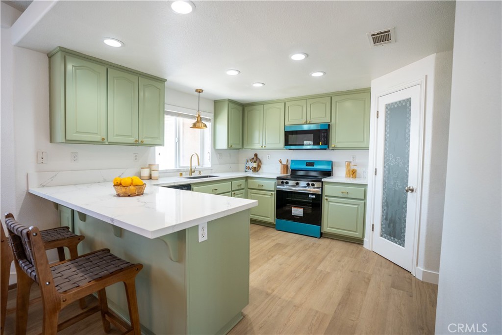 Welcome to the cutest modern farmhouse in the High Desert—where comfort, charm, and convenience come together. MOVE IN READY!!! This serene property offers exceptional access without compromising privacy and tranquility. Step inside to discover a beautifully designed interior featuring updated quartz countertops and custom mint green cabinets with all gold finishes, giving the home a warm, and modern touch. Brand new stainless steel appliances and walk-in pantry making the kitchen as functional as it is stylish. Stay cozy year-round with a wood-burning stove that efficiently heats the entire home along with central AC/HEAT. The spacious master bathroom offers a private retreat, complete with a soaking tub, separate shower, and double sinks. Exterior highlights include: A three-car garage. It comes with two sheds for additional storage (20x20 shed has power) Fully enclosed with a 6-foot chain-link fence for added privacy and security. Solar panels for new owner to take over to save on electricity bill. This property blends modern comfort with farmhouse charm and offers everything you need to live the High Desert lifestyle in style. Don’t miss your opportunity to call this one-of-a-kind home yours!