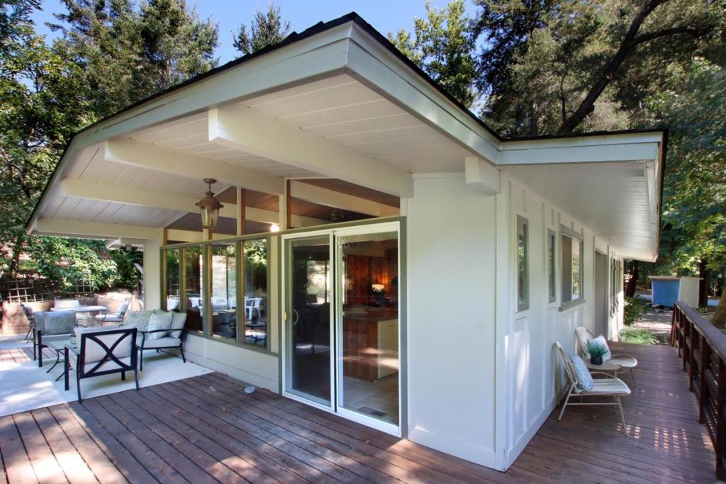 The best of both worlds, and beyond! Privately situated on nearly a half acre above a year round creek , walking distance to the Bear Creek swim and racquet park. This Eichler-esque mid 60's modern home has the flair and feel of Sunset magazines snappy getaways homes of that era. With floor to ceiling glass windows looking onto the deck-forest and creek below, from its spacious open beam ceiling living room with wood burning fireplace. Expansive deck with sunshine and shade connecting to patio yard and walkway. Walking path and horseshoe pit that could become Bocci ? Spacious carport with storage and laundry area, and plenty of visitor parking as well. This cozy slice of heaven awaits the buyer that wants privacy in a safe neighborhood setting, with the convenience of being only a couple miles from town in the friendly community of Bear Creek Estates. A place where your neighbors are nearby, but not side by side out your window. Classy compact and private is what characterizes this property, an ideal place to entertain alfresco, with all of the great outdoor spaces. Only 20 minutes to Los Gatos at highway 17, and 35 to the epicenter if Silicon Valley. 5 minutes to Boulder Creek and just 30 minutes to Santa Cruz. Great commuter home, or if you're lucky what a great office!