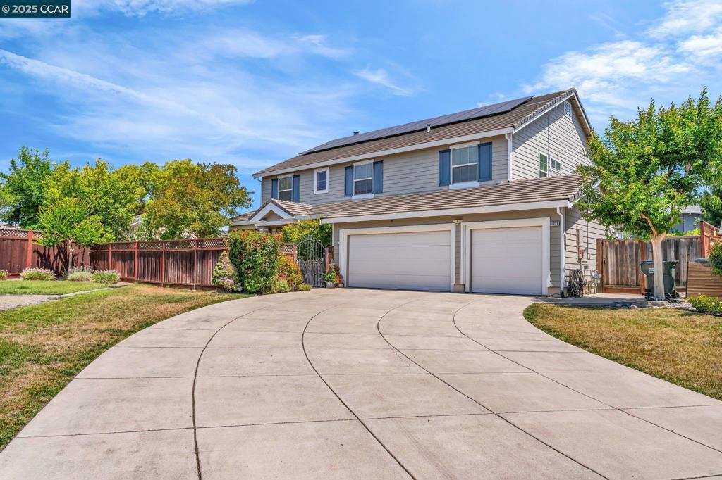 Awesome opportunity to own this large "Executive" home. Fantastic NEW price! 4003 sq ft of living space! Spacious, open concept floor plan, lots of large windows for natural light. Full bath & bedroom downstairs. Family room with wood burning fireplace & raised hearth. Kitchen features white cabinets, quartz countertops, gas cooktop, center island, ample storage, separate spacious eating area, built-in desk & views to the backyard. Also, on the main floor, is a separate living room & formal dining room. Den/Office/Bedroom & laundry room with sink and exterior access. Dramatic stairs lead to a huge bonus room perfect for a second family room or game room. Grand master bedroom suite with sitting area & ensuite bath. Master bath has separate soaking tub & shower, dual sinks & vanity. Large walk-in closest. Upstairs are 3 additional bedrooms, full hall bath & open landing. Huge private yard with a little play area, huge grassy area, producing fruit trees (cherry, peach, apricot and apple), fire pit, covered patio, side yard for basketball & storage. Room for pool! Energy efficient Solar system. Other features include hardwood, carpet, tile, auto sprinklers, three car garage, tile roof, dual pane windows, dual-zone HVAC & NEW water heater. MUST SEE!