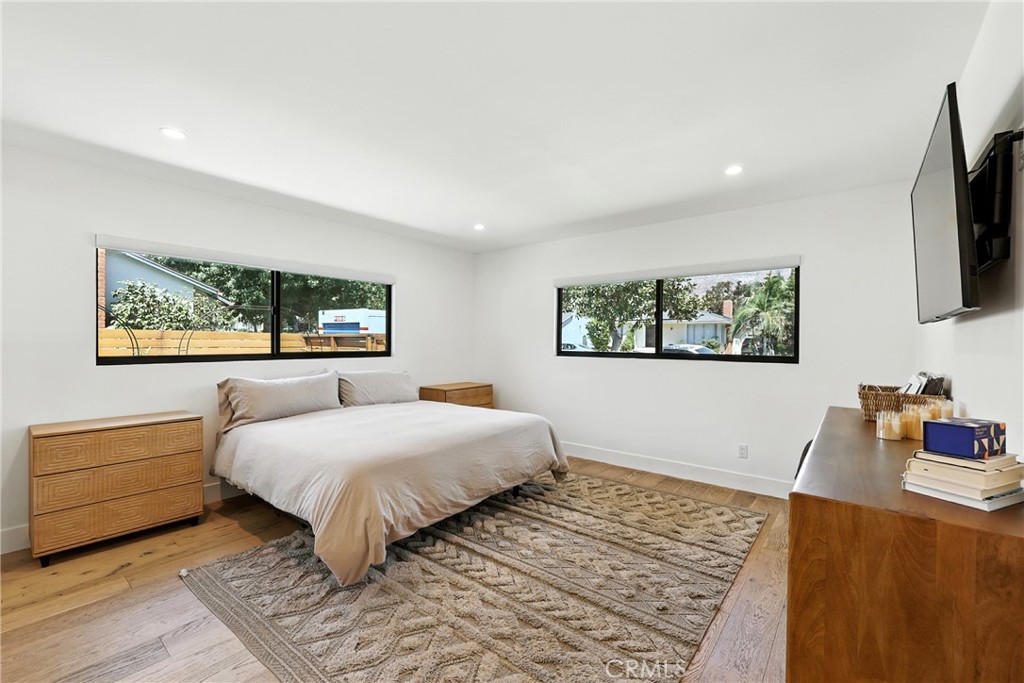 A Beautifully Updated Home with Views, Space, and Style. This fully reimagined home in Northeast Pasadena has everything you’re looking for—modern upgrades, mountain views, and a large 11,000 sq foot flat lot with a custom outdoor entertaining oasis with tons of potential for additional expansion. Inside, you’ll find a bright open layout with great flow between the living room, dining area, and kitchen. The custom kitchen features quartz countertops, shaker cabinets, a black stainless steel range, and a spacious island—perfect for cooking and entertaining. There's also a walk-in pantry with floating shelves for extra storage. Every bedroom has built-in closets, and the primary suite includes a walk-in closet and a spa-like bathroom with dual shower heads and serene mountain views. Step outside and enjoy a newly built patio deck that leads to a custom outdoor kitchen under a beautiful pergola—great for relaxing or hosting friends. The entire yard is fully irrigated, fenced with redwood, and ready for anything you can dream up—there’s plenty of space for a pool or an ADU. Major upgrades include: New solar power system, Upgraded electrical panel and system, Double-pane, noise-cancelling black aluminum windows, Brand-new presidential roof, Tankless water heater, Two laundry areas inside for added flexibility, Exterior lighting throughout the property. The home is close to local parks, great schools and just minutes from Eaton Canyon hiking trails. Whether you're looking to move right in or expand with a pool or ADU, this home has the space, upgrades, and location to make it all possible.