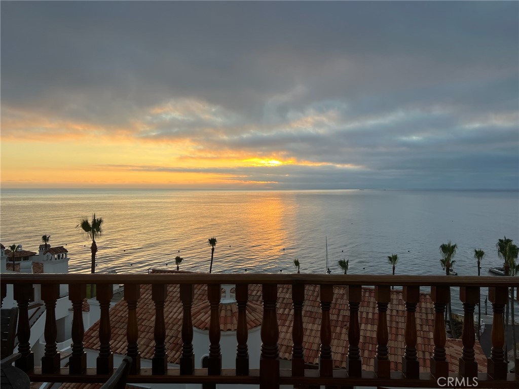 Catalina Island ~ Hamilton Cove Condominiums! This 2-bedroom 2-bathroom unit has been tastefully decorated to give you that instant vacation beach city feeling. Leave your personal items ready to use in the owner's closets so you can travel unencumbered to your relaxing ocean view condo. The current owners have loved this unit, and it shows. They put care into maintaining it and have enjoyed it for many years. Built in 1986 the property has had upgrades over the years. 860 sq. ft +/- of end unit living space accented by a wider than average balcony to enjoy as additional outdoor living space. Located in the middle of building 2 in convenient proximity to the clubhouse, pool, hot tub, and gym. Property has a short-term rental license which should transfer to the new owner. Both the living room and bedroom open with French doors onto the balcony overlooking the unimpeded view of the beautiful blue sea. Property comes furnished with appliances and a golf cart! Hamilton Cove is a private and exclusive gated community that has an abundance of amenities which include beach access, gym with locker room, clubhouse, pool, spa, all grass putt-putt golf course, grass croquet court, tennis courts, half basketball court, playground, beachfront picnic areas with outdoor charcoal BBQ, dingy dock, pier, sand volleyball court, and small watercraft storage! Avalon is a fantastic place to work remotely. The resort town of Avalon is loved by all. Seize the day and make this property your slice of paradise!